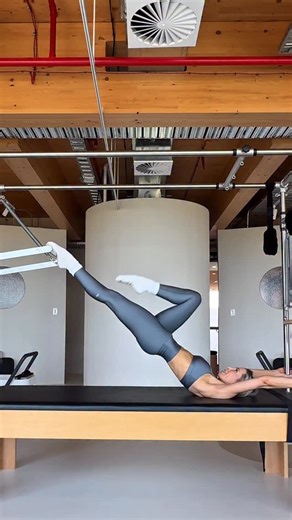 Roz Evans: Pilates | Mobility | Wellness on Instagram: "What’s better than Pilates? Pilates… but a little bit spicy✨ This is single-leg Parakeet and it’s one of the most challenging exercises on the Cadillac for a reason. I definitely don’t program it often… but I love practicing it. Why? Because it’s not about the shape. It’s about total-body integration. You’re working from the feet all the way up: • intrinsic foot strength & ankle stability • deep glute + adductor support • lumbopelvic contro