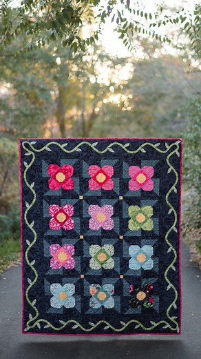 The Raised Flower Garden quilt pattern by Bluebird Patterns is the perfect quilt for anyone wanting to try appliqué! 🪡 Visit the RBD Blog to see more of this beautiful quilt in the Floral Gardens collection and to get a copy of this pattern today🌸 https://www.rbdblog.com/2024/01/05/raised-flower-garden-quilt-by-bluebird-patterns/ | Riley Blake Designs