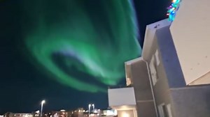 Exceptionally bright aurora borealis lights up the night sky in Reykjavik, Iceland