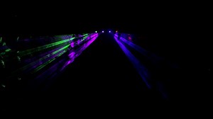 Download Colorful laser show in the dark background. for free