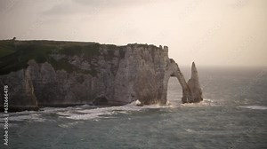 Cliffs of Etretat, Normandy, France. French rock landmark on the shore. One of the most popular and visited places in France by tourists from all over the world. High quality 4k footage