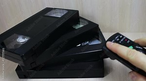 stack of VHS video tape cassette and popron