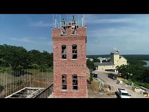 Discover the Art of Expert Brick Laying on a New Masonry Tower | brick house building