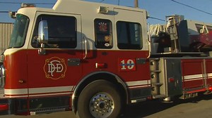 Patient crashes ambulance into Dallas warehouse