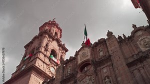 SLOW MOTION WIDE ANGLE SHOT OF THE CATHEDRAL OF MORELIA AT SUNSET FROM BELOW