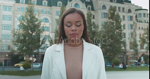 Confident black female folding arms, looking at camera, women's empowerment
