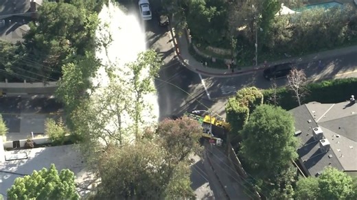 Large utility truck crash shears hydrant in L.A. neighborhood