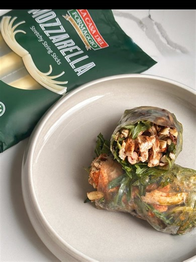 Chicken Pesto Rice Paper Wraps with Stringy Mozzarella 🤤 Using the @lacasadelformaggio Stringy Cheese Sticks not only brings me back to my childhood but they also add an additional 5g of Protein which brings these wraps to 45g of Protein 🤯 #wrap #chicken #highprotein #lunch #easyrecipe