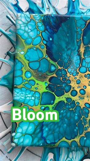 A bloom with blue, green & gold cell activators. #kimjamesonart #cellart #fluidart #sheleeartstyle
