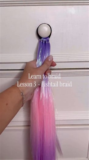 Nancy Amery on Instagram: "Lesson 3 - Fishtail braid 🧜‍♀️ ✨ split the hair into 2 Start on the right strand ✨ using your index finger and hook a small section from the outside of the strand ✨cross it over the top and add it to the inside of the left stand ✨repeat on the other side Let me known in the comments what braids you’d like to learn next #learntobraid #fishtailbraid #mermaidhair #girlshairstyles #cutehairstyles #hairtutorial #braidtutorial"