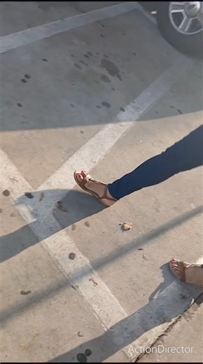 Candid latina with pretty red toes at Texaco