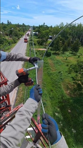 😱 Watch Linemen Secure Overhead Power Lines with Lock Wire! ⚡#Lineman #PowerLines #UtilityWork