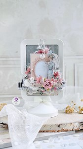 An altered frame, all dressed up with @frankgarciastudio French Blue collection 🩵🌿 Scraphomework- Ania Rokicka layered papers, lace, buttons, pearls, florals (and that piano strip detail 😍) to turn a simple frame into a fully dimensional paper-crafted beauty. So many layers, so many details… swoooon! That’s the magic of our paper collections. Pure DIY paper crafting! #papercraft #alteredframe #ikeahack | Prima Marketing Inc.