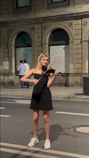 The talented and beautiful violinist Oleksandra Melnyk performing on the streets of Warsaw, Poland.