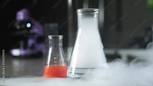 Beakers and test tubes with the solution are in the laboratory. Scientific experiment in biochemistry. scientific or medical modern laboratory. The nitrogen evaporates in the tubes.