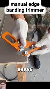 The video demonstrates the use of a manual edge banding trimmer, a specialized woodworking tool designed to cleanly remove excess laminate or pvc edge band from the edges of a board. While the user initially shows the difficulty of using a standard utility knife, they quickly switch to the orange handheld trimmer, which holds a snap-off blade at a precise angle. This allows the user to slide the tool along the board, effortlessly shaving off a continuous curl of waste material to create a perfec