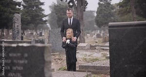 Child, death or father in graveyard for funeral. spiritual service or burial for respect in Christian religion. Rose, depressed or sad kid in cemetery for grief, loss or mourning with dad for support