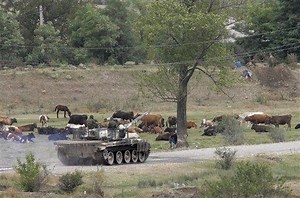 Watch: Russian Tank Goes Out of Its Way to Run Over Civilian Vehicle in Ukraine