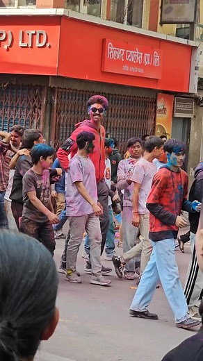 A 7-foot man, attracting all the attention of the crowd at Basantapur, Kathmandu, Nepal during Holi celebration #saninmaharjan #holi2082 #happyholi2026 #vlog #pov