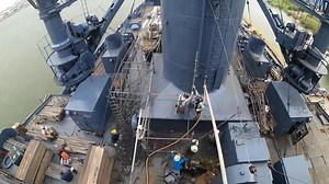 Yesterday, the scaffolding surrounding the smokestack came down revealing the freshly repaired and partially restored smokestack. In addition to making the stack watertight and structurally sound, we reinstalled some missing features. During the repair work the whistle dismounted, thoroughly disassembled, and repaired -its 100 year old electric solenoid (control) was brought back to life. The ship's siren was complete gone through, made functional again, and reinstalled on the stack for the firs