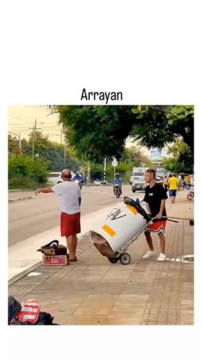buzz__decode on Instagram: "The video depicts a group of Indonesian men in red shorts comically wheeling large, graffiti-covered trash barrels labeled "LULUS" (meaning "graduate") through urban streets, nearly colliding with cars and surprising pedestrians for humorous effect. Posted on December 15, 2025, it amassed 391,000 views and 273 replies in two days, with commenters in Indonesian laughing at the "naughty" pranks and "panicked" reactions, highlighting its rapid viral spread on X. This con