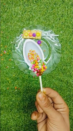 Dairy milk lolly 🍡 with small gems 🍬