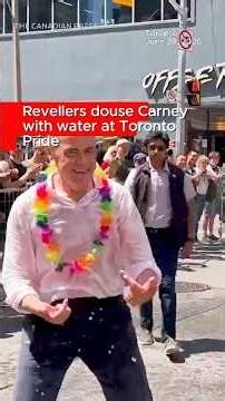 Revellers douse Carney with water at Toronto Pride