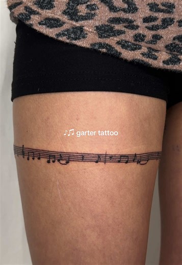 music note leg wrap around #tattoo | garter tattoo