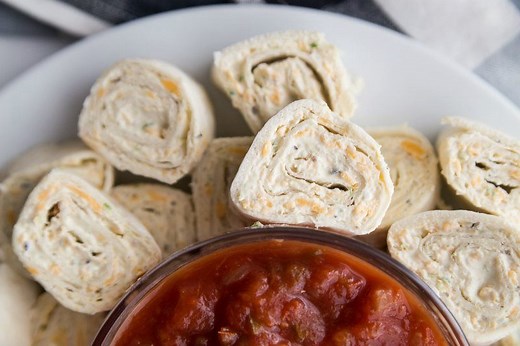 Texas Tortilla Roll Ups are a super easy make-ahead appetizer recipe perfect for serving at parties. Print the recipe here: https://www.recipegirl.com/texas-tortilla-roll-ups/ | RecipeGirl