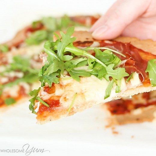 289K views · 326 reactions | This LOW CARB, PALEO pizza crust is thin, crispy, and totally delicious! Using just four common ingredients this recipe is so simple, it could be pizza night every night. FULL RECIPE FROM Wholesome Yum - Low Carb Recipes HERE => https://www.wholesomeyum.com/recipes/paleo-pizza-crust/ | Wholesome Yum - Easy Healthy Recipes | Facebook