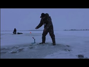 We're catching pike with tip-ups near a washout!! And we even fell through the ice!!!