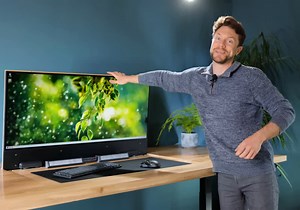 This desk hides a full gaming PC, RTX 4090, and widescreen OLED monitor included