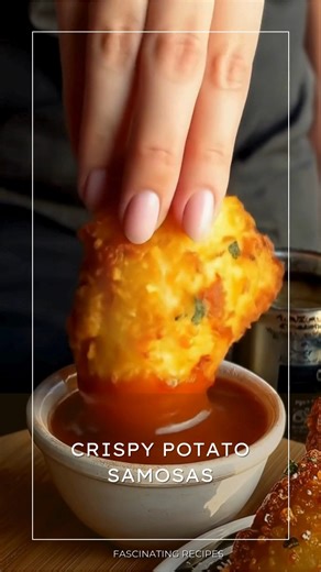 Crispy Potato Samosas *These golden, crispy little triangles have a way of turning an ordinary afternoon into something special. Filled with warmly spiced potatoes and wrapped in flaky pastry, they bring that comforting, familiar feeling of homemade treats meant to be shared—perfect with a cup of tea or for a relaxed gathering.* What You'll Need For the Dough 2 cups all-purpose flour ¼ cup vegetable oil or ghee ½ teaspoon salt ½ cup water, as needed For the Filling 3 medium potatoes, boiled and 