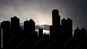 Venezuela: Caracas skyline at Sunrsie, Time Lapse with Fast Clouds and Dark Silhouette of Skyscrapers, South America