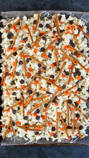 now Day Snack Mix Ingredients: 12 cups popped popcorn (about ½ cup unpopped kernels) 16 oz (450 g) white candy coating or white chocolate bark 3 cups miniature pretzels | Recipe by Lina