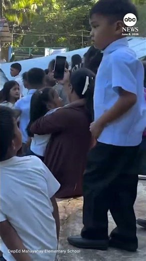 Schoolchildren huddle together as massive quake hits Philippines