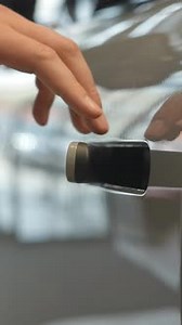 A Man Opens a Car Door with a Fingerprint Integrated Handle Vertical Video