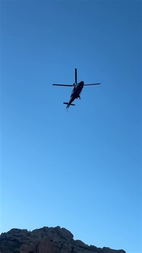 Firebird helicopter dispatched to save a hiker who’s been trapped on Echo Canyon for about 12 hours. Phoenix Fire was able to give him a cell phone, food, water and blankets. The rescue operation is underway. | Dominique Newland