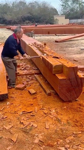 carving large wooden beam into smooth surface using sharp hand tool #shorts