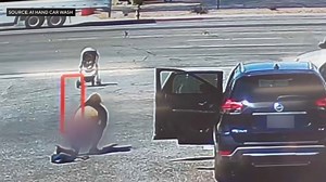 Woman fails to grab out-of-control stroller rolling toward traffic. Then this happens
