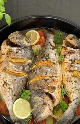 This grilled branzino is stuffed with lemon ,herbs and cooked until the skin is browned and crispy.