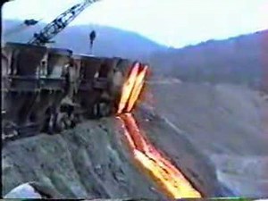 Crane dumps slag.