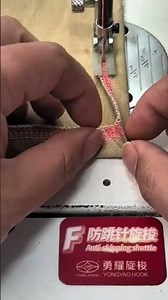 stitching pink zigzag patterns on brown fabric using sewing machine with hands guiding the material