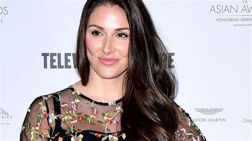 Prem boss finds love with Lucy Pinder as 'besotted' couple spotted at function