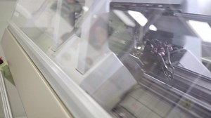 seamless knitting machine moves back and forth to shape clothes, textile detail