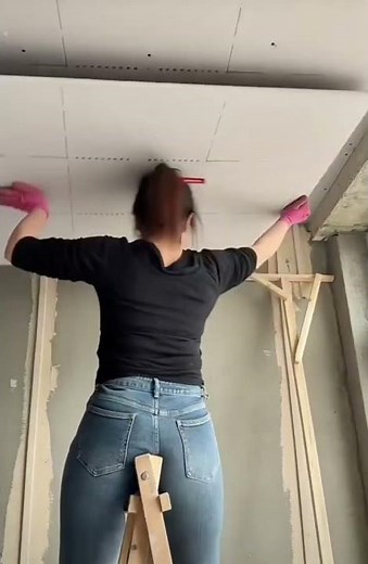 Lift the plywood board with paper and support it with wood then drill the bolts so that it sticks