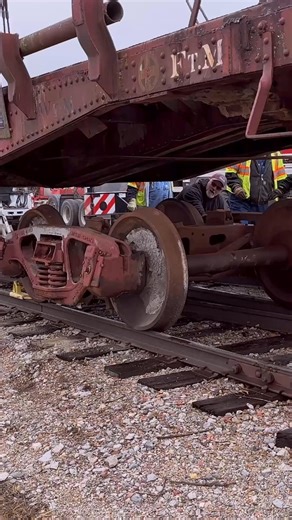 Aligning the center pin on the 44'6" Santa Fe Flatcar 92874 which was delivered to the museum on 2/7/2025 | Oklahoma Railway Museum
