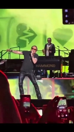 Axl Rose's signature dance is like a snake 🕺🌹 #axlrose #gunsnroses #classicrock #dance