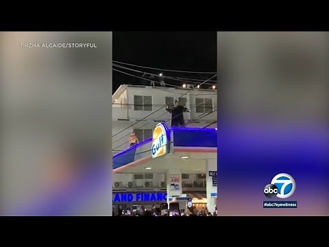 Bad Bunny throws impromptu concert on top of gas station in Puerto Rico
