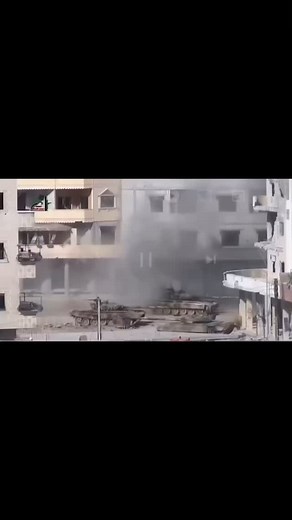 REDACTED on Instagram: "Syria  : Some archive footage from the Syrian Civil war of a Syrian Arab Army tank exploding after receiving an incoming anti tank round. You see at least one of the crew escape from the bottom of the tank out of the escape hatch. Combat Canuck and his collaborators do not support or condone violence in any way. This page is dedicated to documenting a world at war. Video credit to @brrrt_daily"